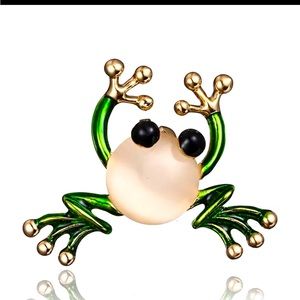 Gold tone frog with green enamel and synthetic opal stone.